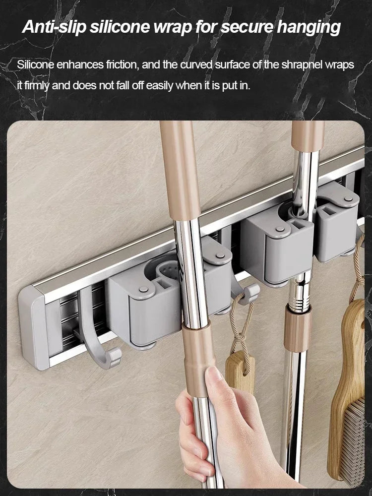 Close-up of anti-slip silicone wrap securing broom handle in wall-mounted rack