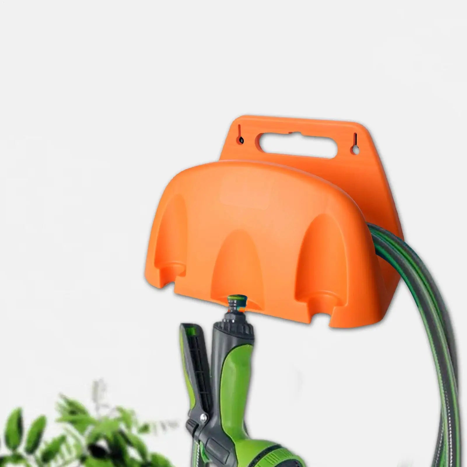 orange wall-mounted hose holder with green hose and nozzle attached outdoors