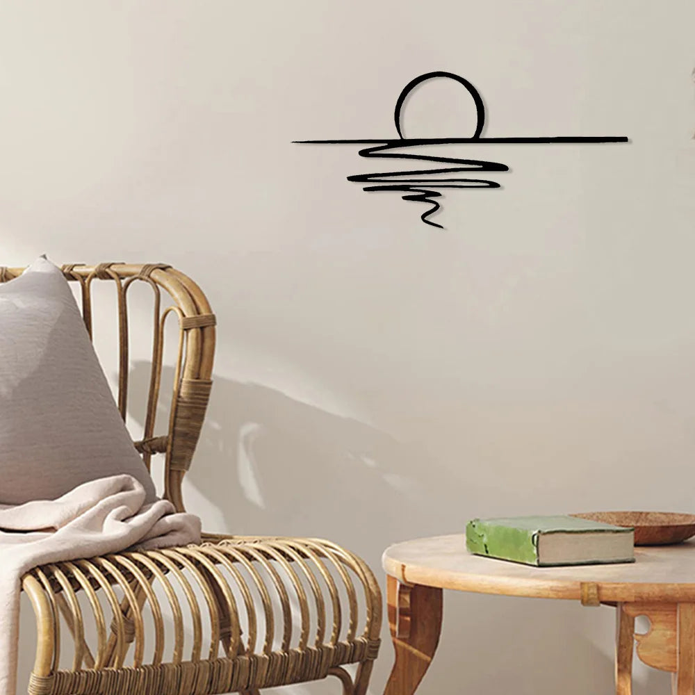 Sunrise line art metal wall sculpture above a rattan chair and side table