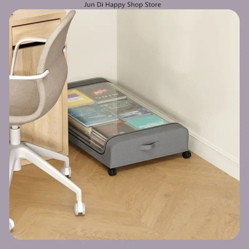 Gray underbed storage drawer used for book and magazine storage beside a desk