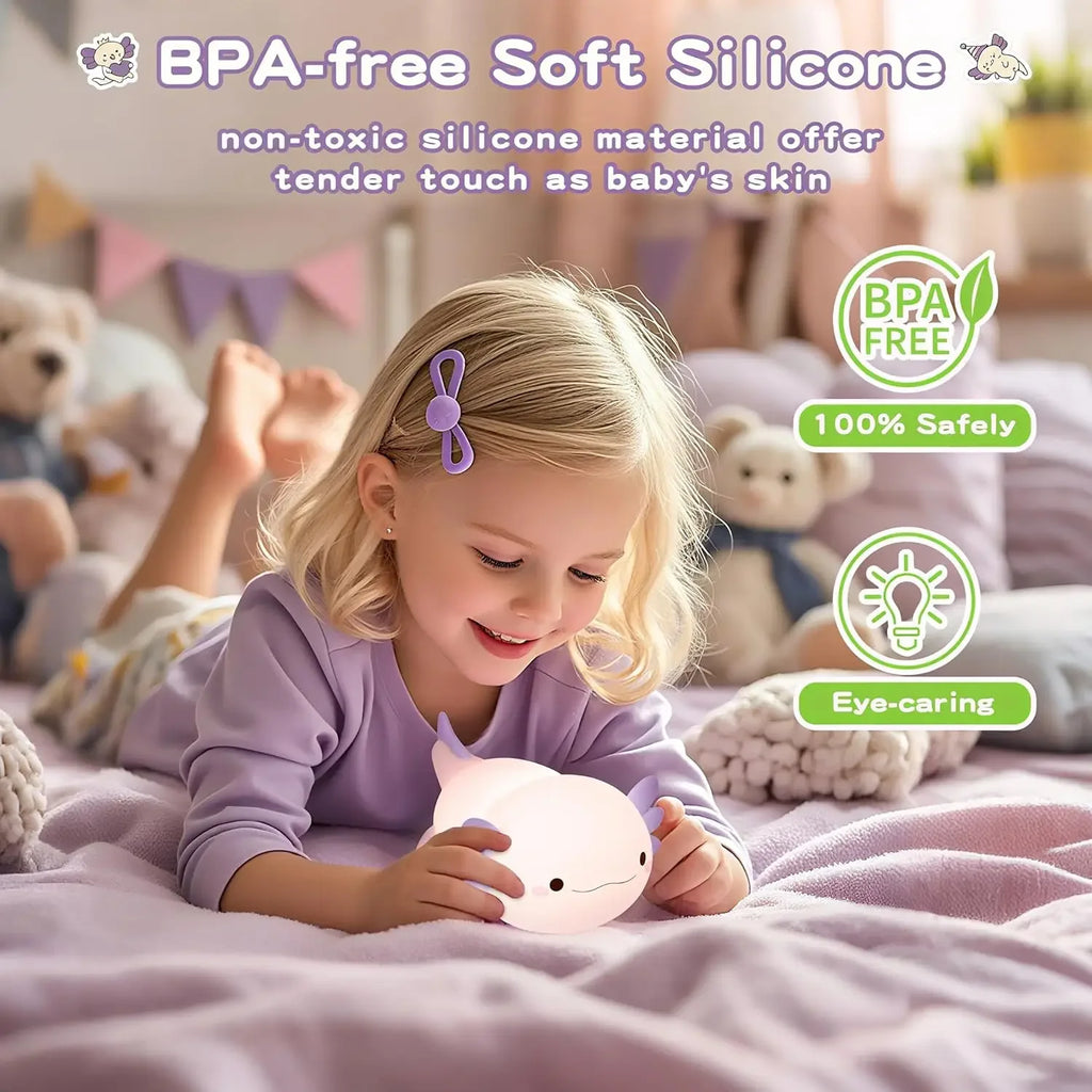 Child holding BPA-free soft silicone axolotl night lamp in cozy nursery