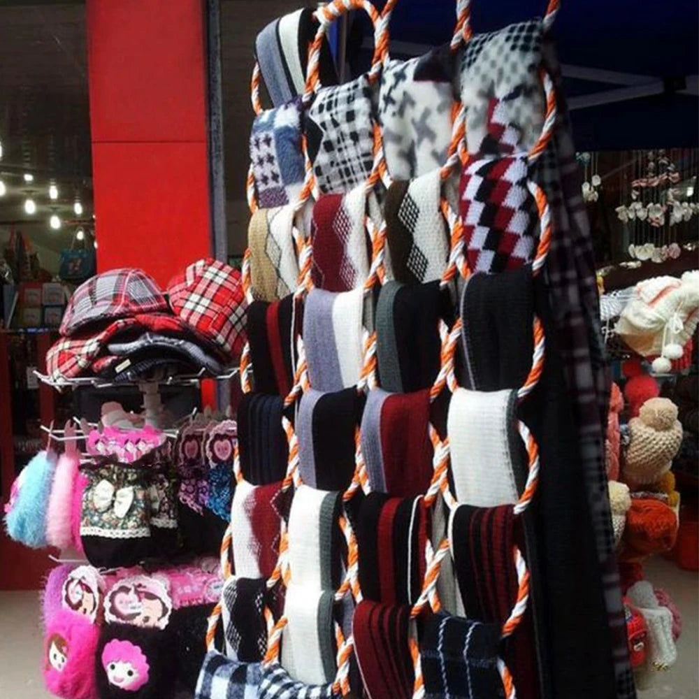 Foldable rattan scarf holder displayed with many scarves in a commercial setting