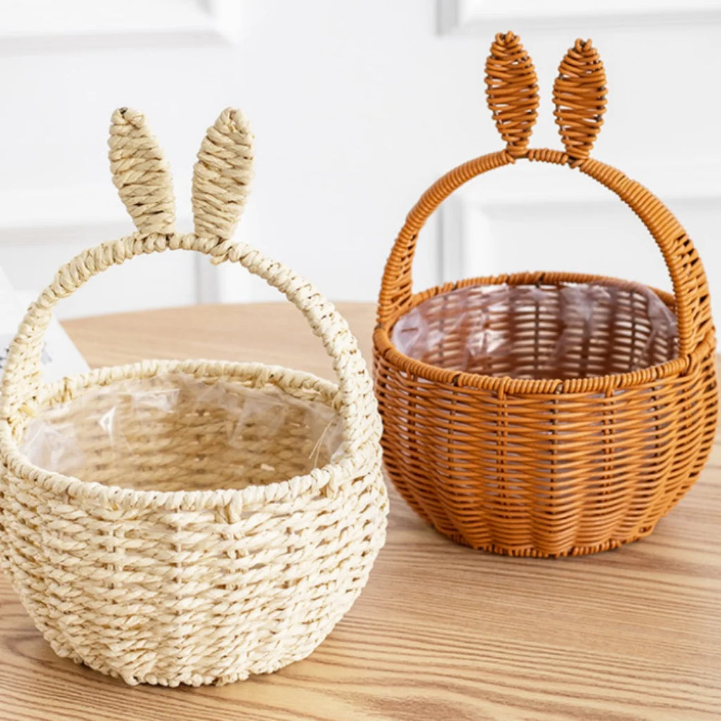 Beige and brown imitation rattan bunny ear baskets on a wooden table