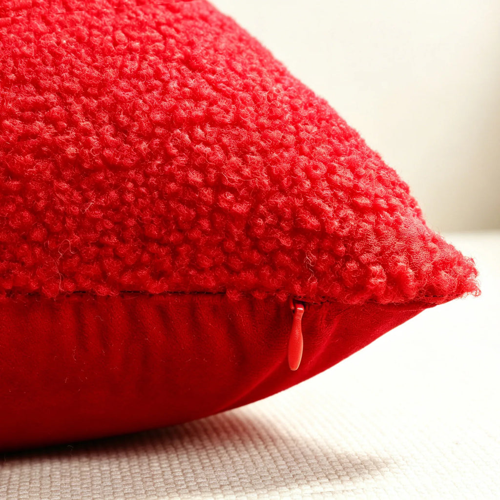 Close-up of red teddy velvet pillow cover showing hidden zipper detail