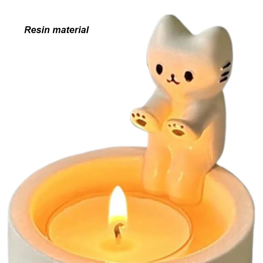 close-up of resin cat tealight candle holder with 'resin material' label
