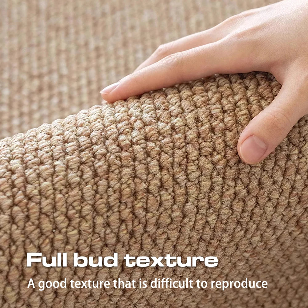hand pressing down on a looped beige doormat, showing the textured polyester surface