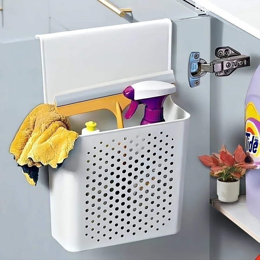 Large white plastic hanging organizer basket on a bathroom cabinet, filled with cleaning spray, cloth, and cleaning supplies.