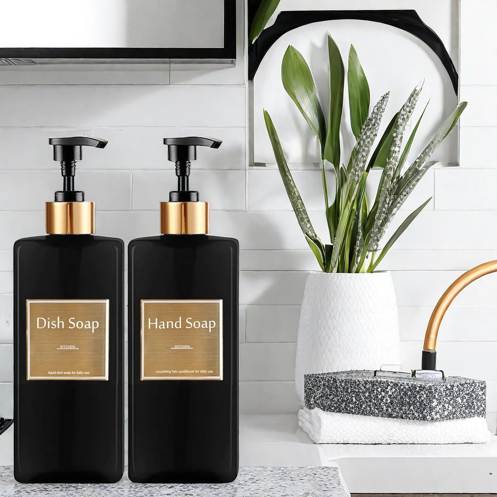 Black soap dispenser bottles labeled for dish soap and hand soap on a modern kitchen counter