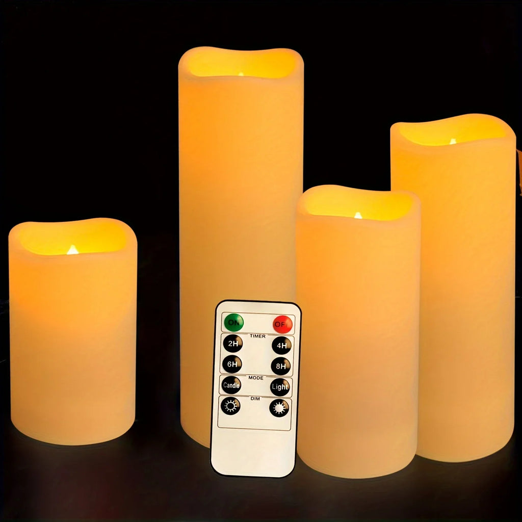 Four ivory flameless LED candles of varying heights with remote control, glowing warmly on a dark background