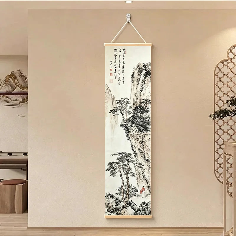 Japanese ink painting scroll with dramatic tall cliffs, shown in a bright hallway