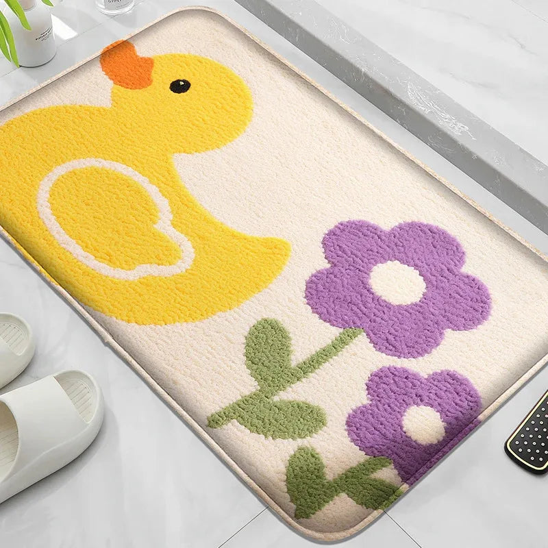 Cartoon anti-slip bath mat with yellow duck and purple flowers on bathroom floor