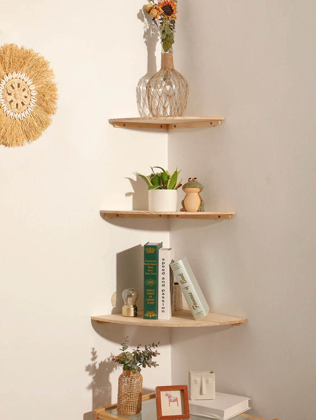 Scalloped wooden corner shelves with natural decor and books used for living room organization