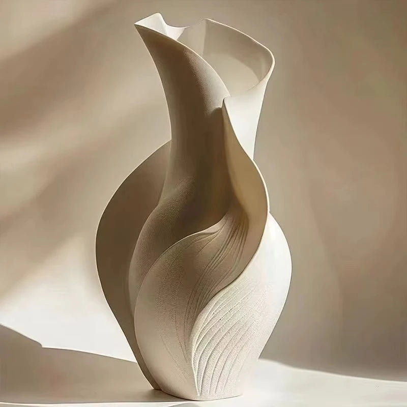 abstract modern ceramic vase with sculptural lines in white