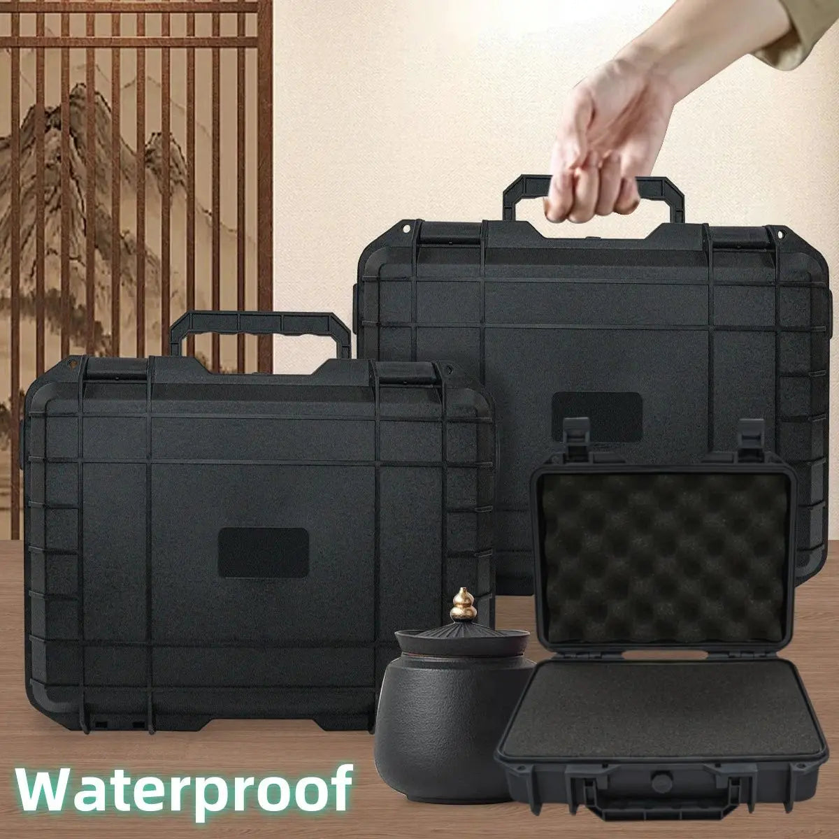 Three black plastic hard cases, one open to show protective foam interior, with kitchen or living room decor in the background.