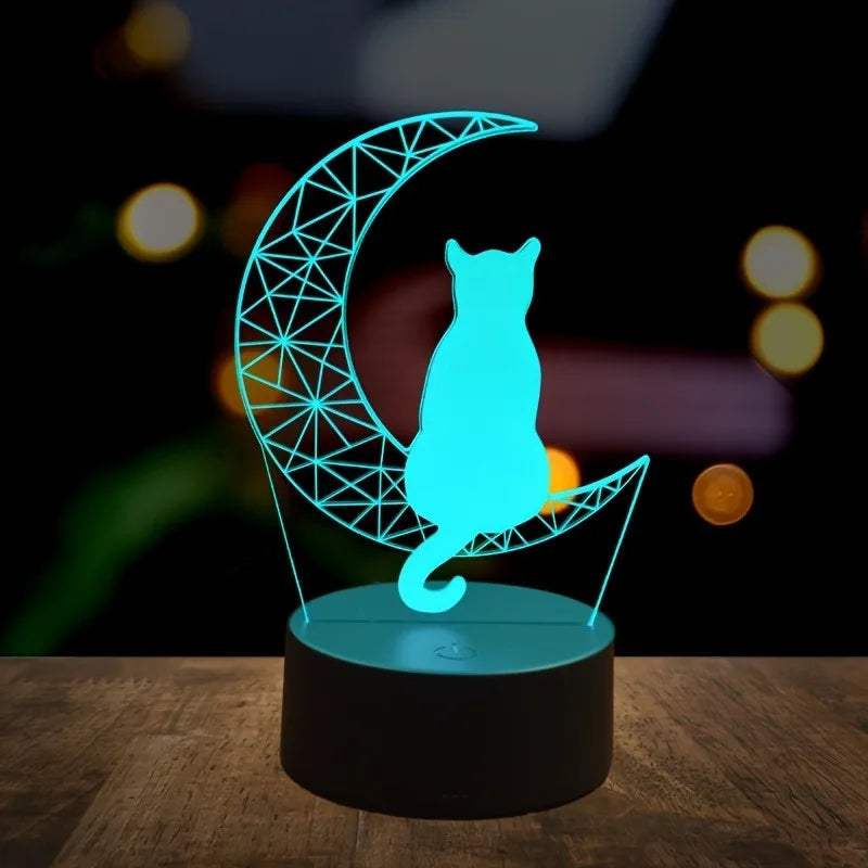 3D LED cat night light glowing in teal on a black base