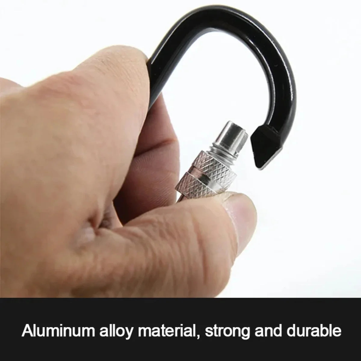 Close-up of hand holding a black locking carabiner hook showing the twist-lock mechanism