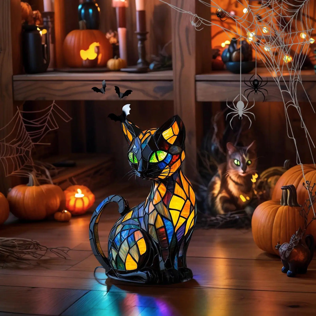Cat shaped LED lamp as Halloween decoration with pumpkins and bat decor