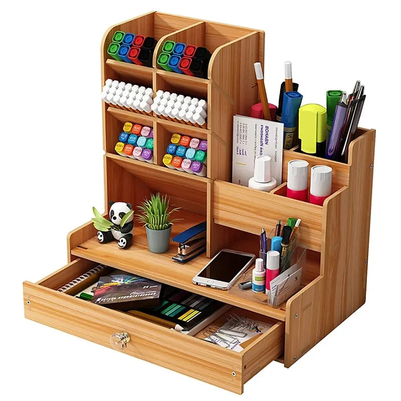 Open drawer view of cherry wood desk organizer holding notebooks and stationery supplies