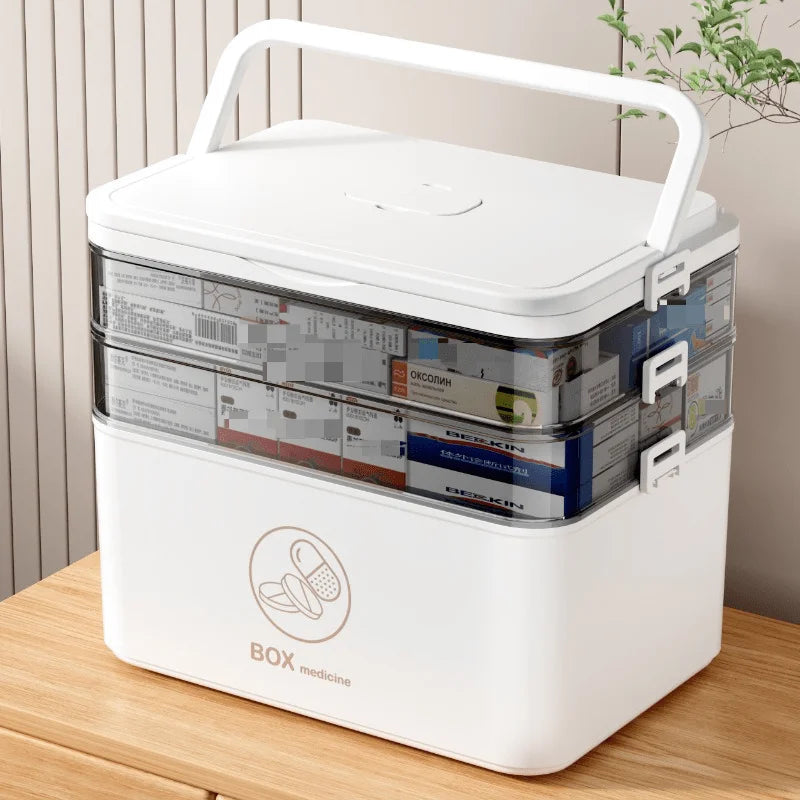 Front angle of the three-tier medicine organizer box in white on a tabletop.