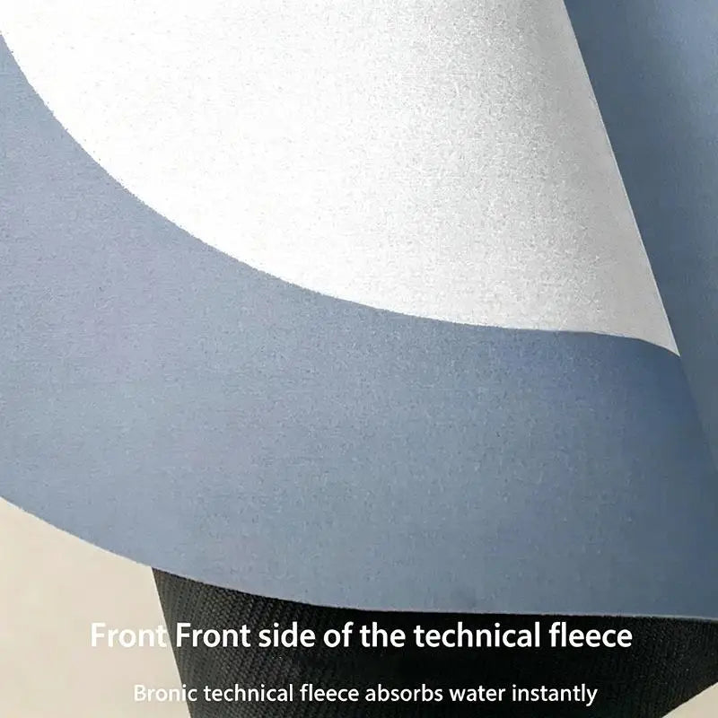 closeup of bath mat surface showing technical fleece front and backside layers