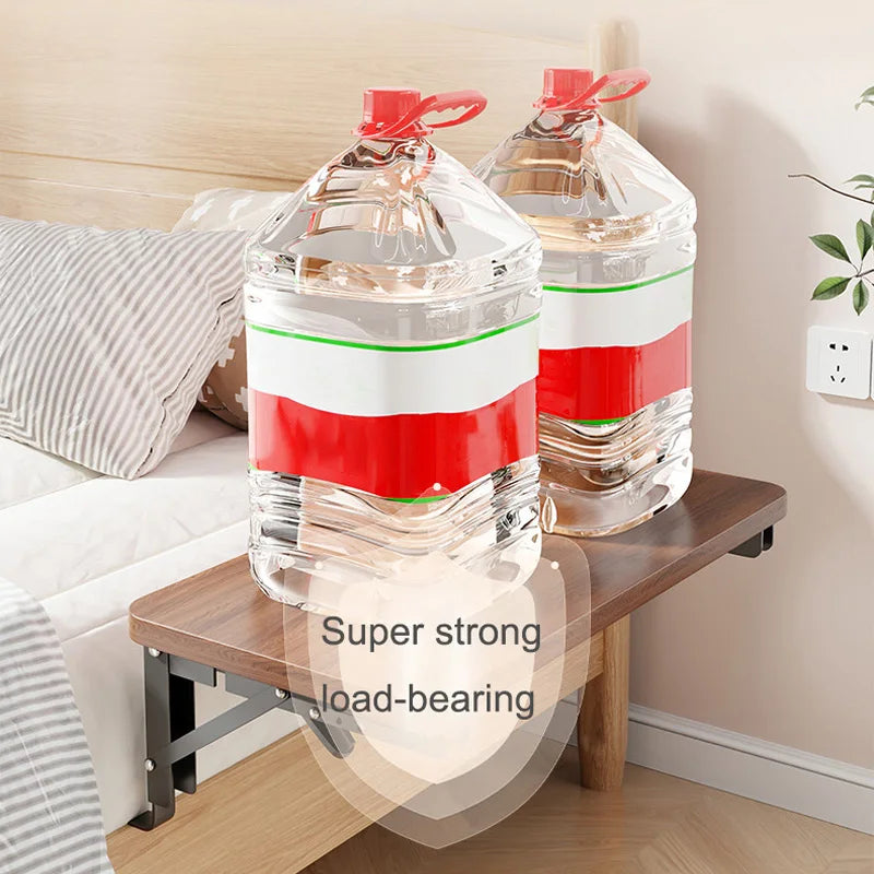 Brown foldable bedside shelf shown holding two large water jugs for demonstration