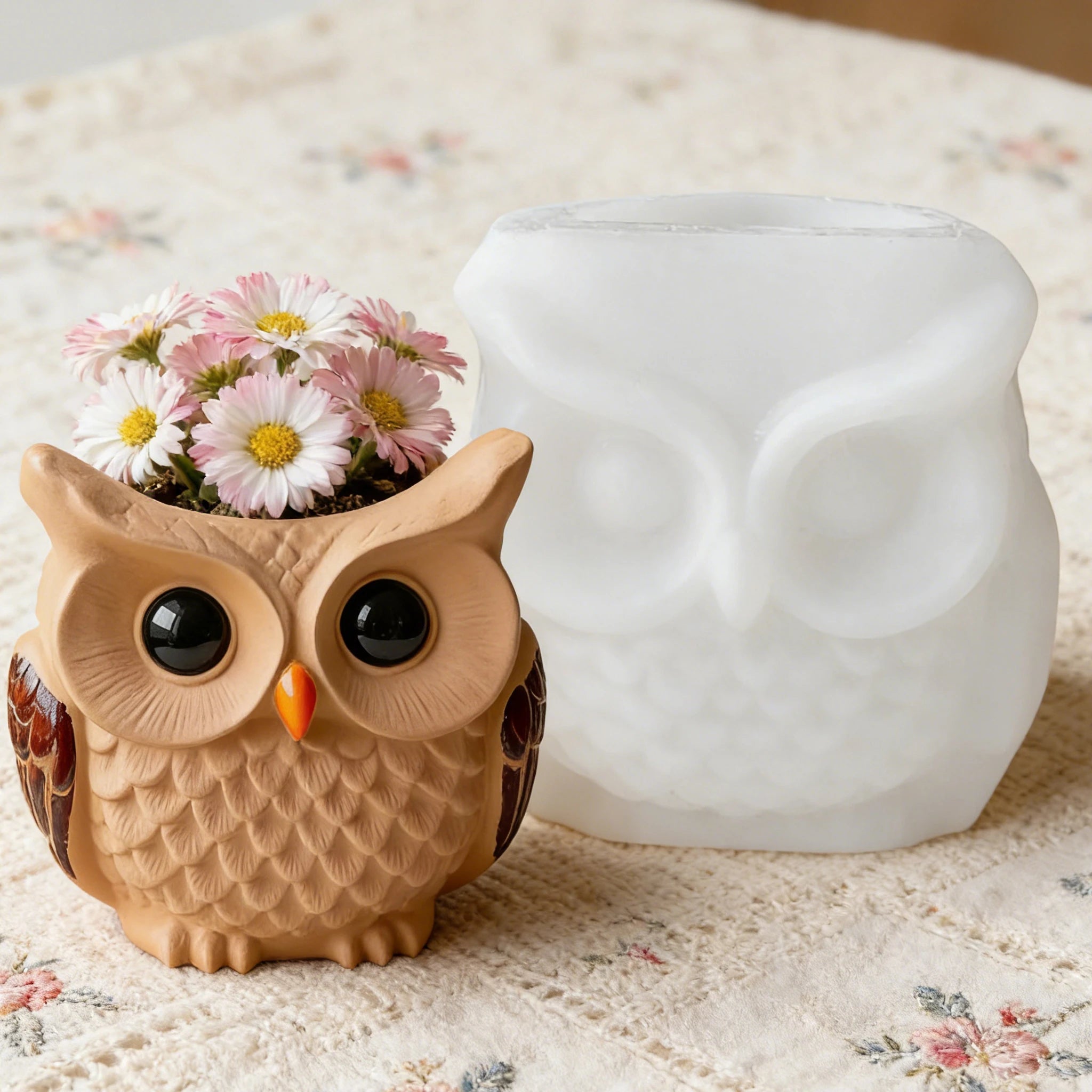 Owl-shaped silicone mold next to finished owl planter with flowers