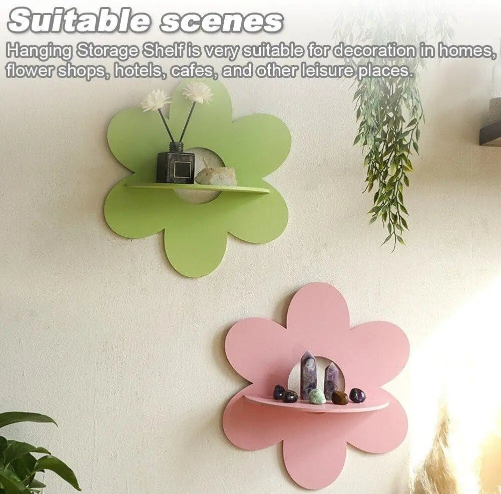 Green and pink flower-shaped floating wall shelves displayed with small decor items