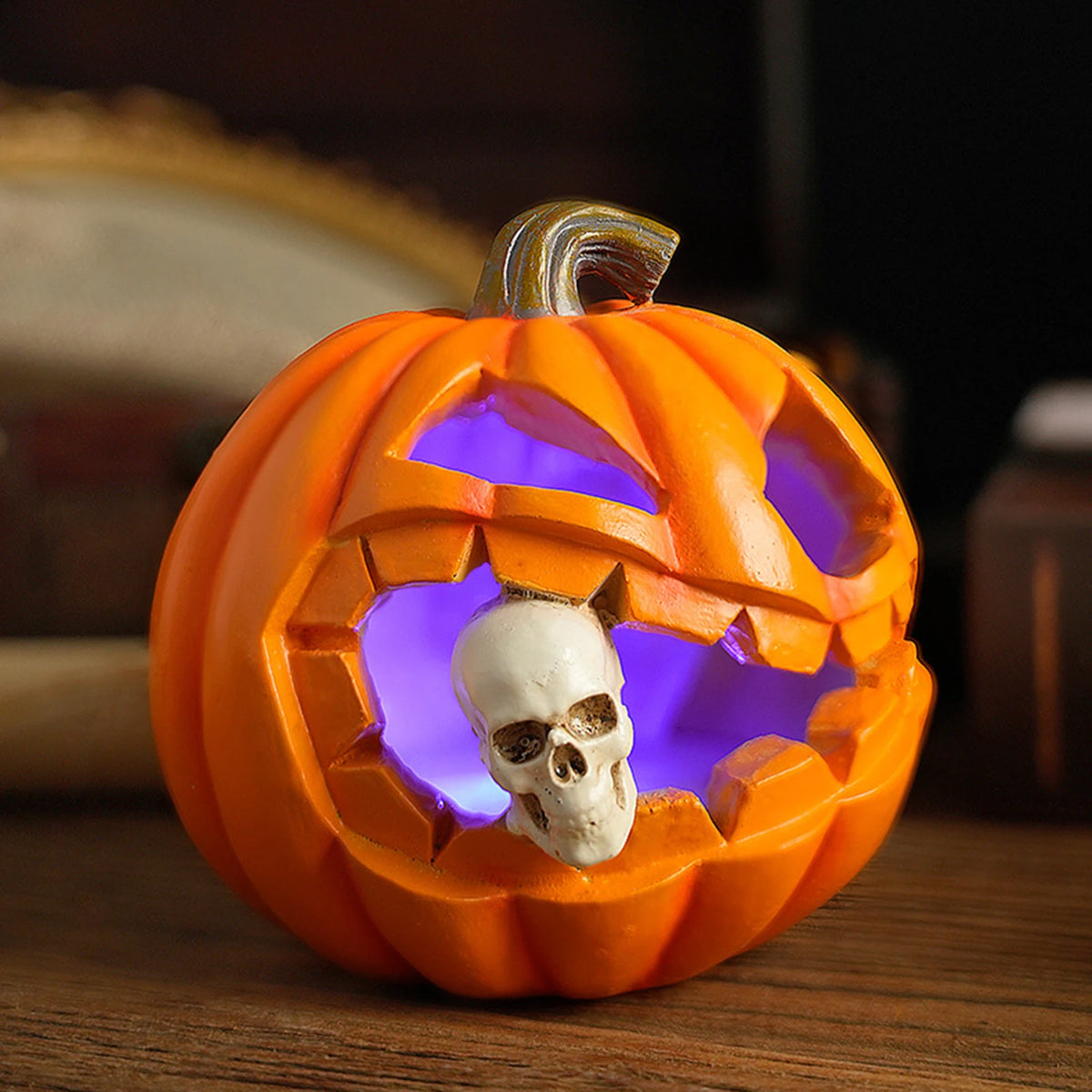 pumpkin lantern with skull statue, soft purple glow, on a wooden table