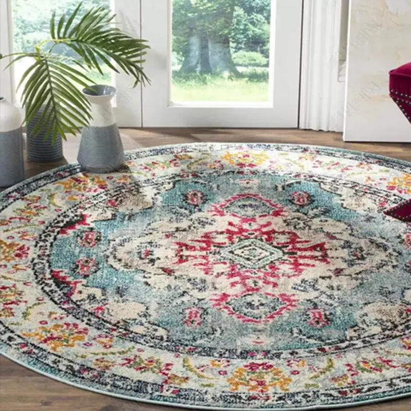 Vintage round Persian-style rug in teal and red in a sunlit living room