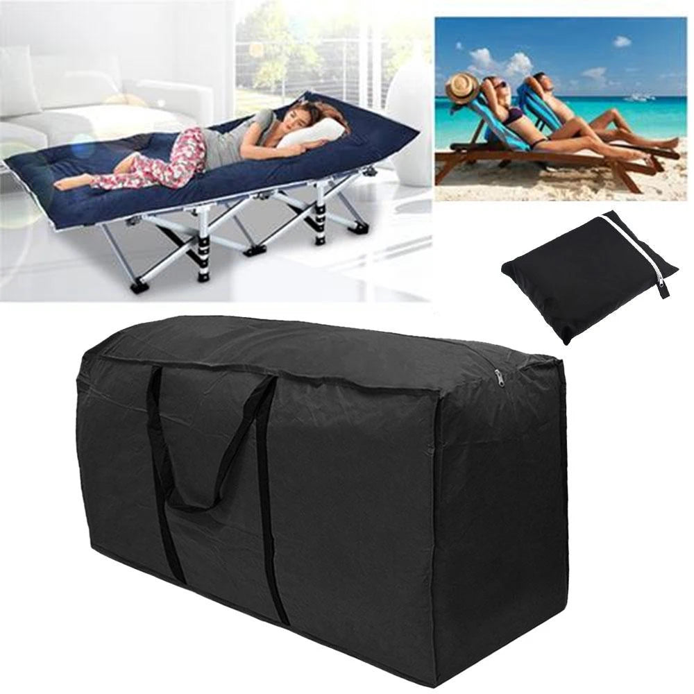 Large black rectangular outdoor storage bag with handles, shown folded and in use for storing lounge cushions and patio gear