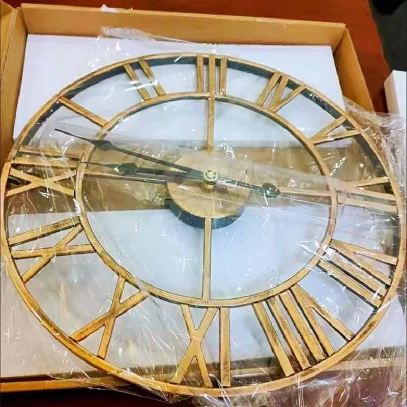 Bronze metal Roman numeral wall clock in packaging with protective wrap