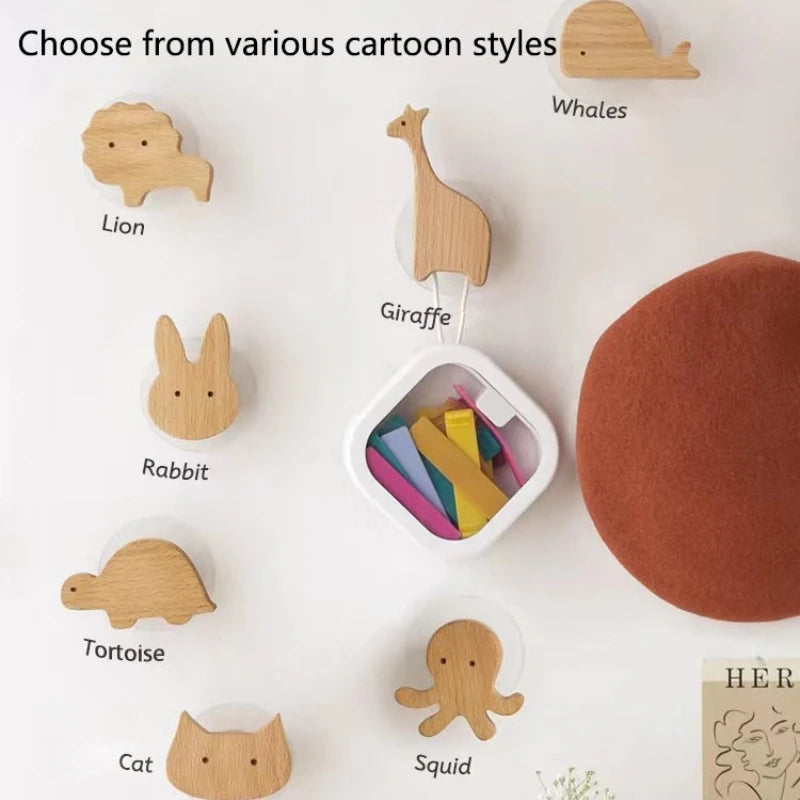 Selection of beech wood animal hooks in various shapes labeled with names