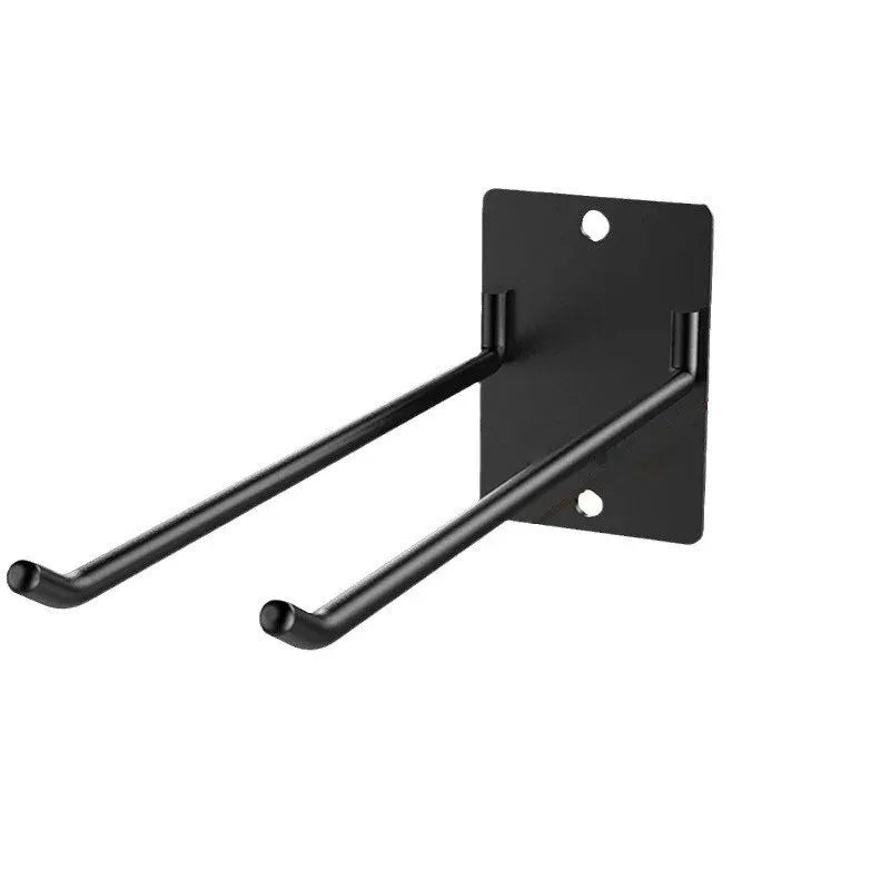 Close-up of empty black iron double hook wall organizer ready for installation on a wall