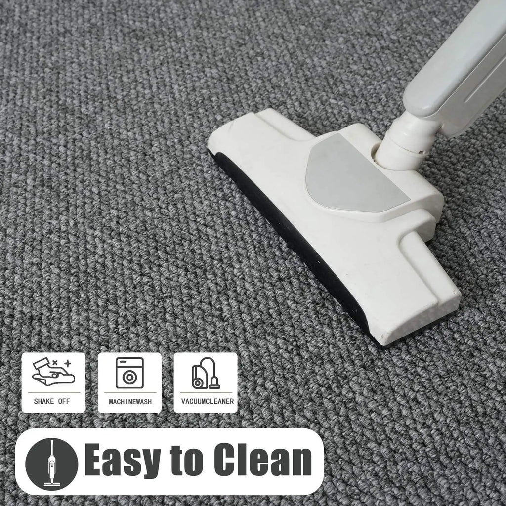 Vacuuming a gray non-slip entry mat, highlighting easy cleaning