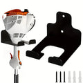 Wall-mounted cast iron tool holder shown holding a trimmer with included mounting hardware