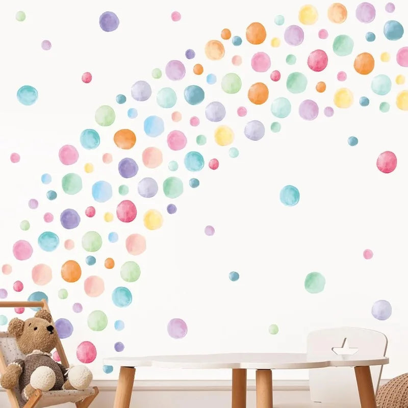 Wave of colorful polka dot wall stickers in a playroom setting with teddy bear