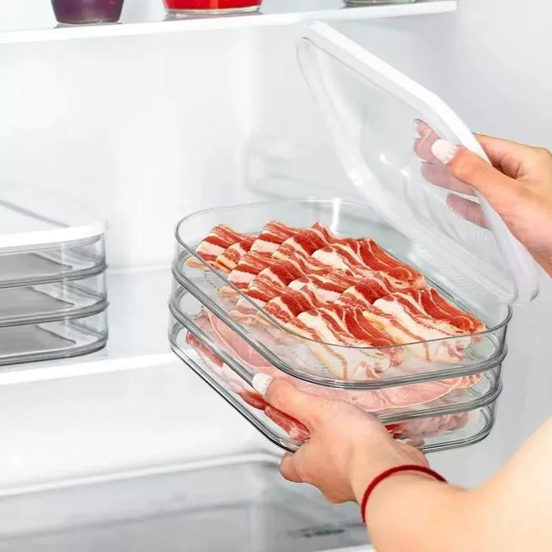 Hand placing stacked deli meat organizers into fridge shelf