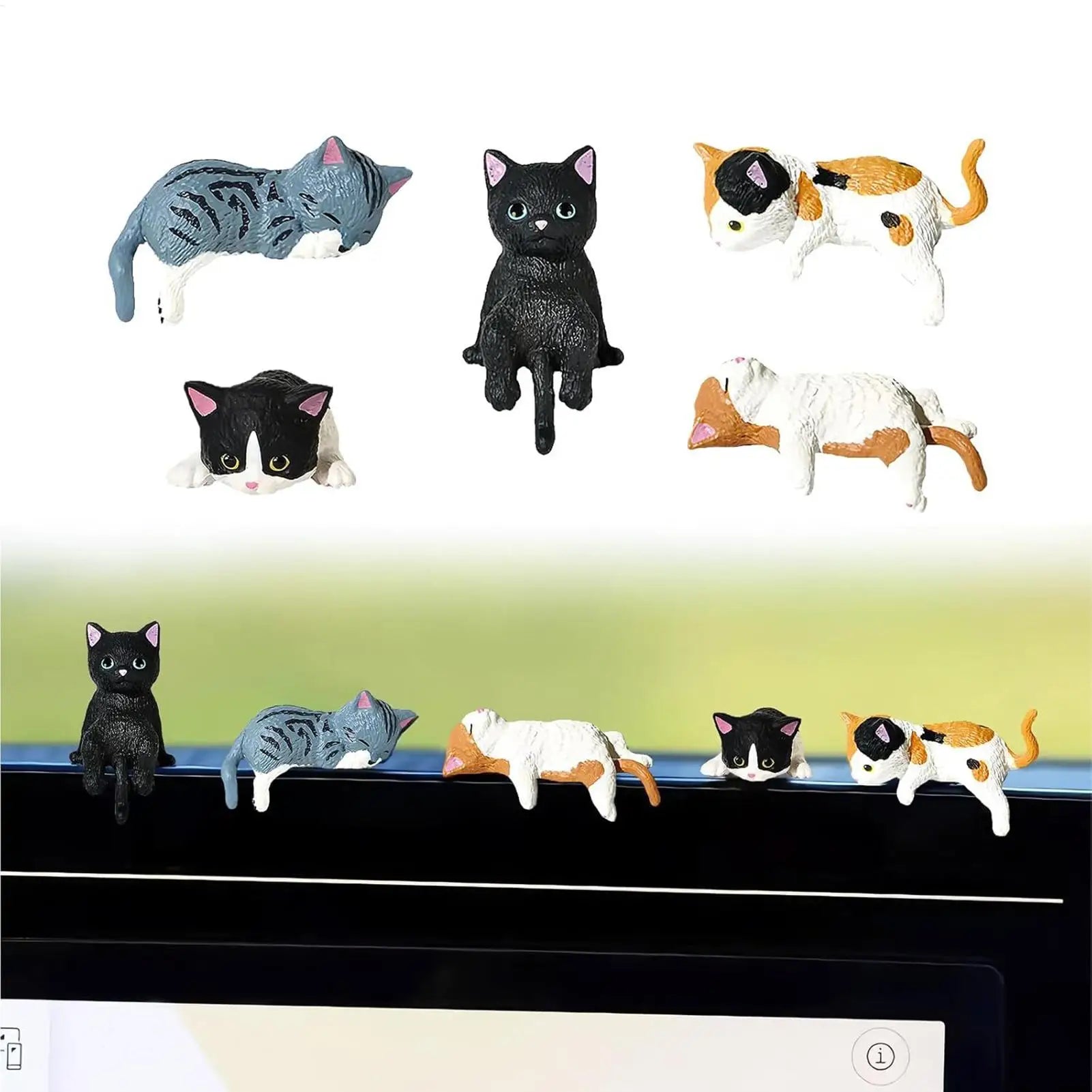 Mini cat figurines displayed on a monitor edge for desk or workspace decoration