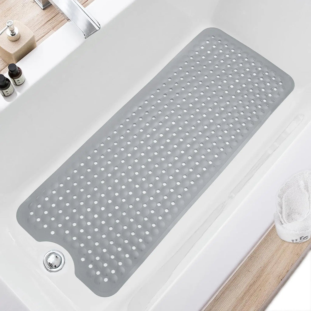 Light grey non-slip bathtub mat with drain holes in a white tub, shown in a modern bathroom setting.