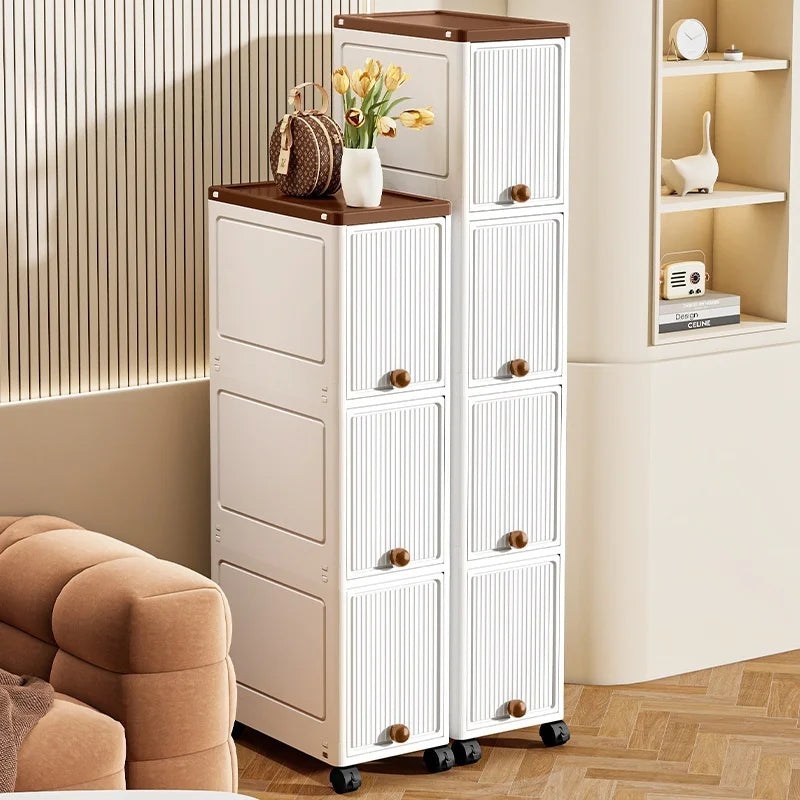 slim rolling storage cabinet with doors in white, styled in living room