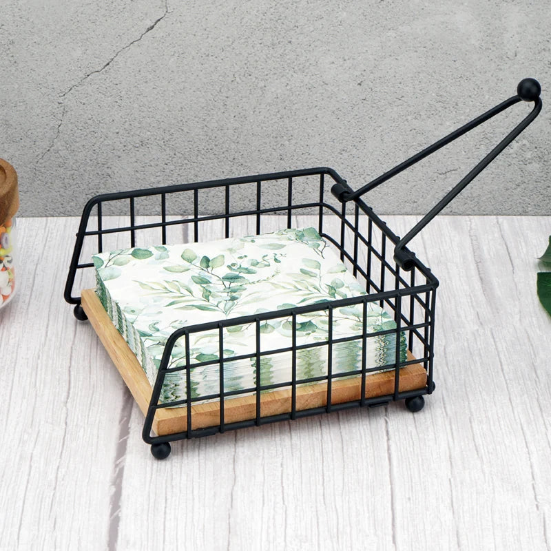 Open rustic metal napkin holder showing swing arm lifted and napkins inside