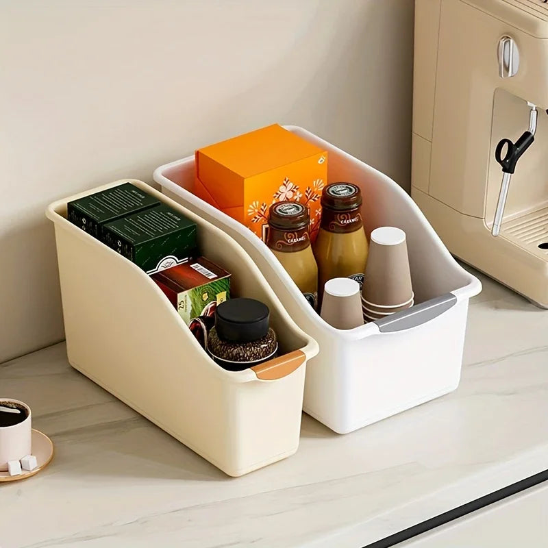 Yellow and white curved storage bins on a kitchen counter for pantry and coffee items