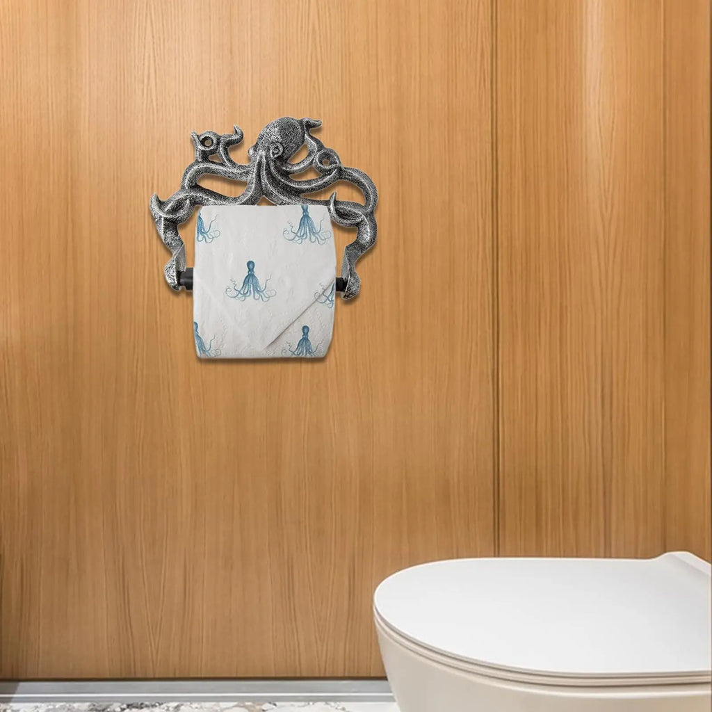 Octopus toilet paper holder mounted on a wooden bathroom wall beside a toilet