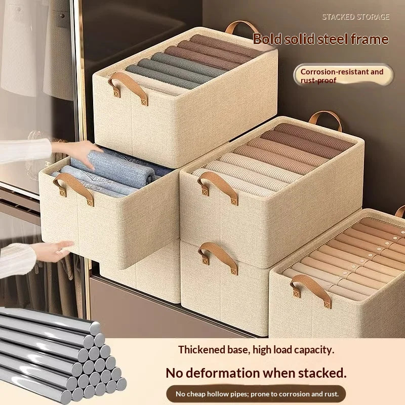 Multiple beige canvas storage bins stacked in a closet, each holding folded clothes
