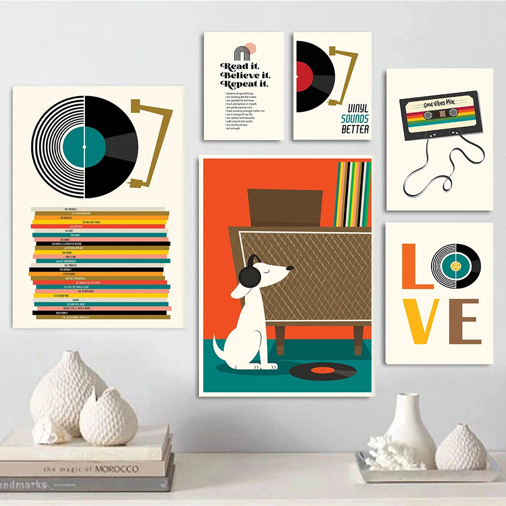 Set of mid-century vinyl records and music-themed canvas art prints arranged on a wall above a shelf with books and vases