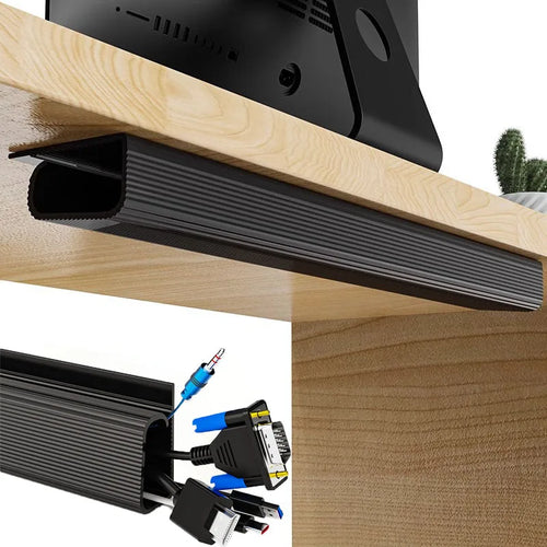 Black adhesive under-desk cable management channel attached to a wooden desk with cables inside