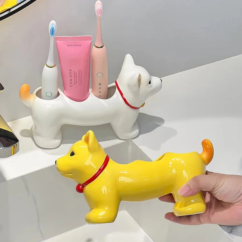 Two dog-shaped ceramic toothbrush holders, one white and one yellow, on a bathroom counter—showing toothbrushes and toothpaste stored upright
