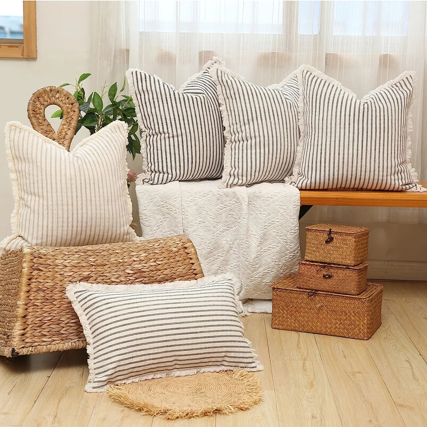 Group of striped and woven pillow covers styled in a bright living space
