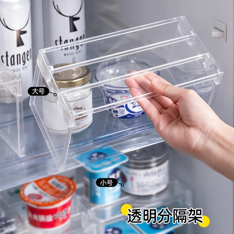 Clear plastic shelf divider used in fridge for organizing yogurt and jars, hand adjusting shelf