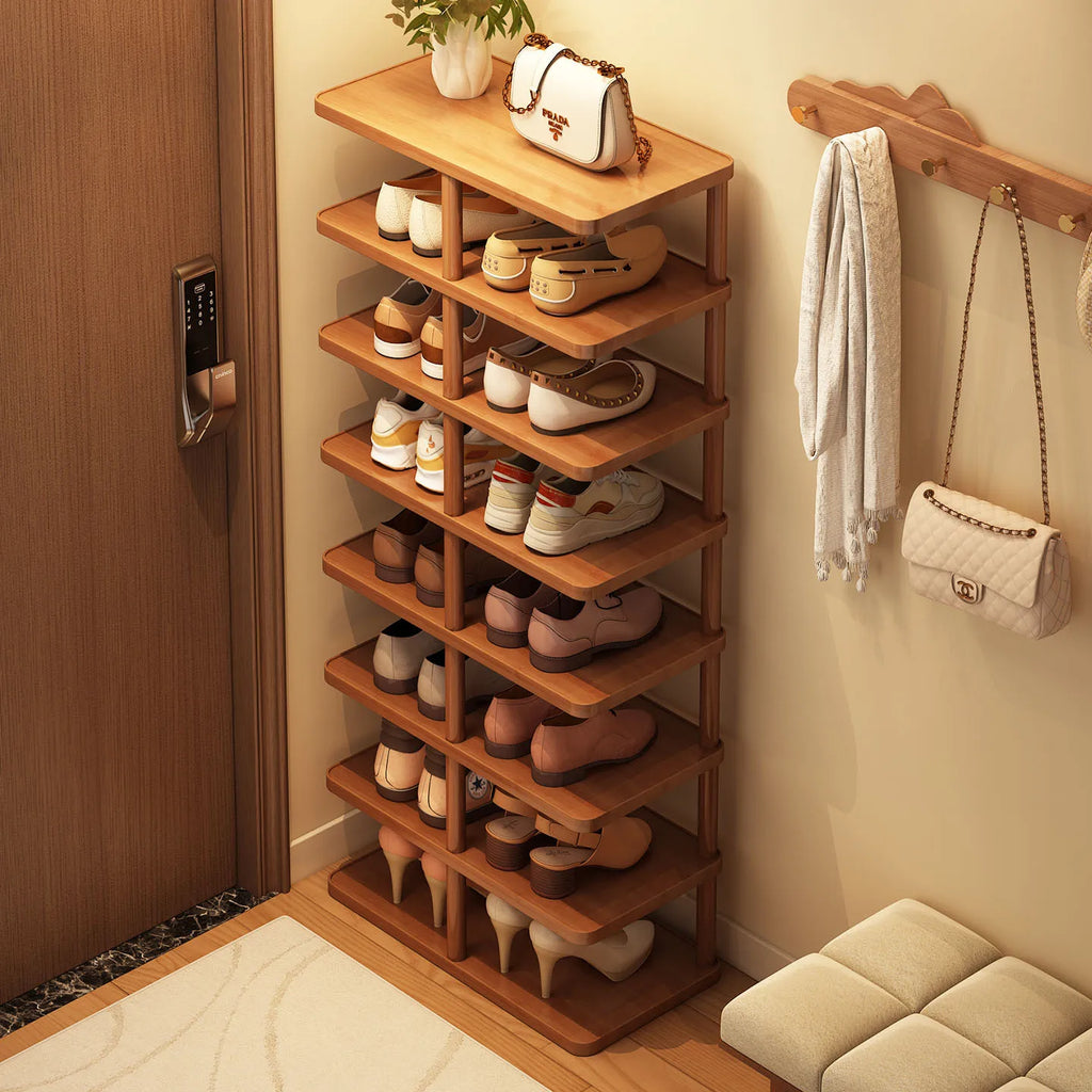 Bamboo multi-layer shoe rack in an entryway with shoes neatly organized